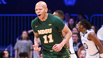 Dec 10, 2024; Indianapolis, Indiana, USA; North Dakota State Bison guard Jacari White (11) celebrates after making a three-point basket during the first half against the Butler Bulldogs at Hinkle Fieldhouse. Mandatory Credit: Robert Goddin-Imagn Images