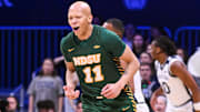Dec 10, 2024; Indianapolis, Indiana, USA; North Dakota State Bison guard Jacari White (11) celebrates after making a three-point basket during the first half against the Butler Bulldogs at Hinkle Fieldhouse. Mandatory Credit: Robert Goddin-Imagn Images