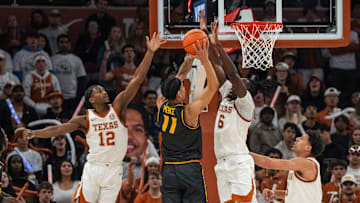 Missouri Tigers guard Trent Pierce (11) has a shot blocked at the rim in a game against the Texas Longhorns this season.
