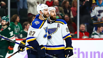 Nov 2, 2019; Saint Paul, MN, USA; St. Louis Blues defenseman Alex Pietrangelo (27) celebrates with center Ryan O'Reilly (90) after O'Reilly scored a goal in overtime against the Minnesota Wild at Xcel Energy Center. Mandatory Credit: David Berding-Imagn Images