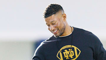 Notre Dame head coach Marcus Freeman greets his players during a Notre Dame football spring practice.