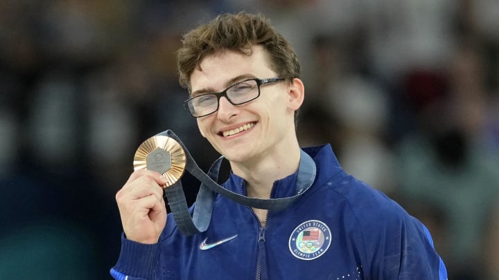 Aug 3, 2024; Paris, France; Stephen Nedoroscik of the United States poses for a photo with his bronze medal on the pommel horse on the first day of gymnastics event finals during the Paris 2024 Olympic Summer Games at Bercy Arena.