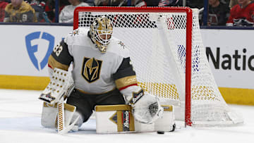 Mar 13, 2025; Columbus, Ohio, USA; Vegas Golden Knights goalie Adin Hill (33) makes a pad save against the Columbus Blue Jackets during the third period at Nationwide Arena. Mandatory Credit: Russell LaBounty-Imagn Images