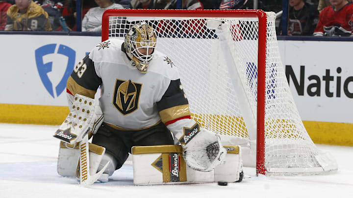 Mar 13, 2025; Columbus, Ohio, USA; Vegas Golden Knights goalie Adin Hill (33) makes a pad save against the Columbus Blue Jackets during the third period at Nationwide Arena. Mandatory Credit: Russell LaBounty-Imagn Images