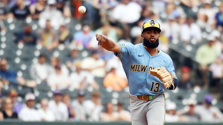 Jun 7, 2026; Denver, Colorado, USA; Milwaukee Brewers infielder Luis Rengifo (13) throws to first base for the final out against the Colorado Rockies in the second inning at Coors Field. Mandatory Credit: Christopher Hanewinckel-Imagn Images
