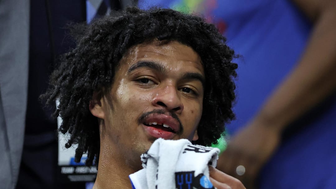 Mar 20, 2026; Philadelphia, PA, USA; UCLA Bruins guard Skyy Clark (55) reacts after having his tooth knocked out against the UCF Knights in the second half during a first round game of the men's 2026 NCAA Tournament at Xfinity Mobile Arena. Mandatory Credit: Bill Streicher-Imagn Images