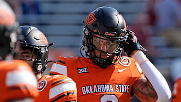 Oklahoma State's Ollie Gordon II (0) warms up before the college football game between the Oklahoma State Cowboys and the Arkansas Razorbacks at Boone Pickens Stadium in Stillwater, Okla.,, Saturday, Sept., 7, 2024.