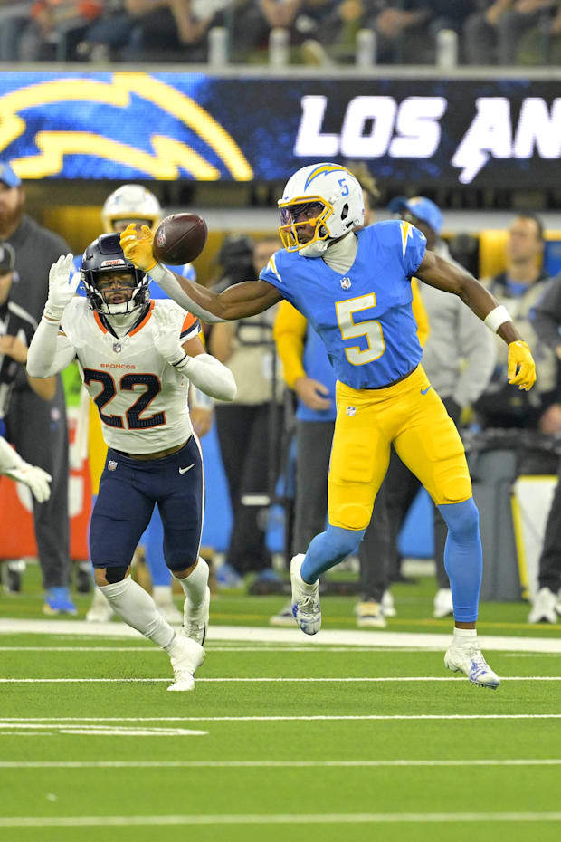 Los Angeles Chargers wide receiver Joshua Palmer can’t get the ball as he is defended by Denver Broncos safety Brandon Jone