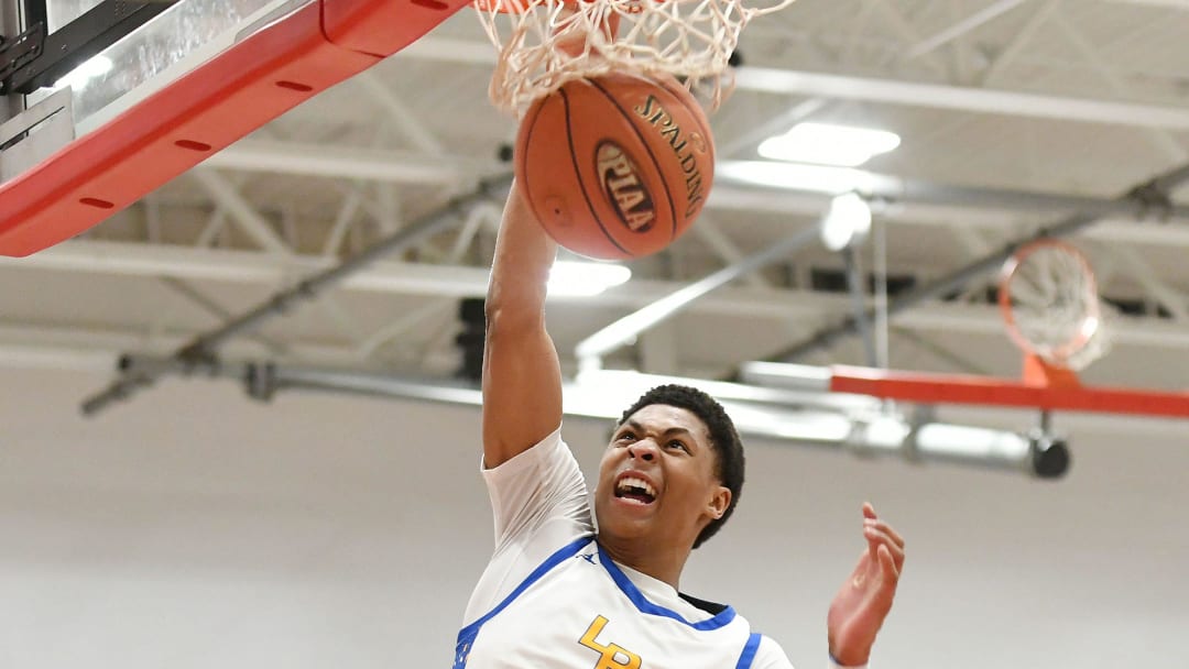 Lincoln Park   s Meleek Thomas dunks the ball during Friday   s PIAA Class 4A quarterfinal game against North Catholic at Fox Chapel High School.