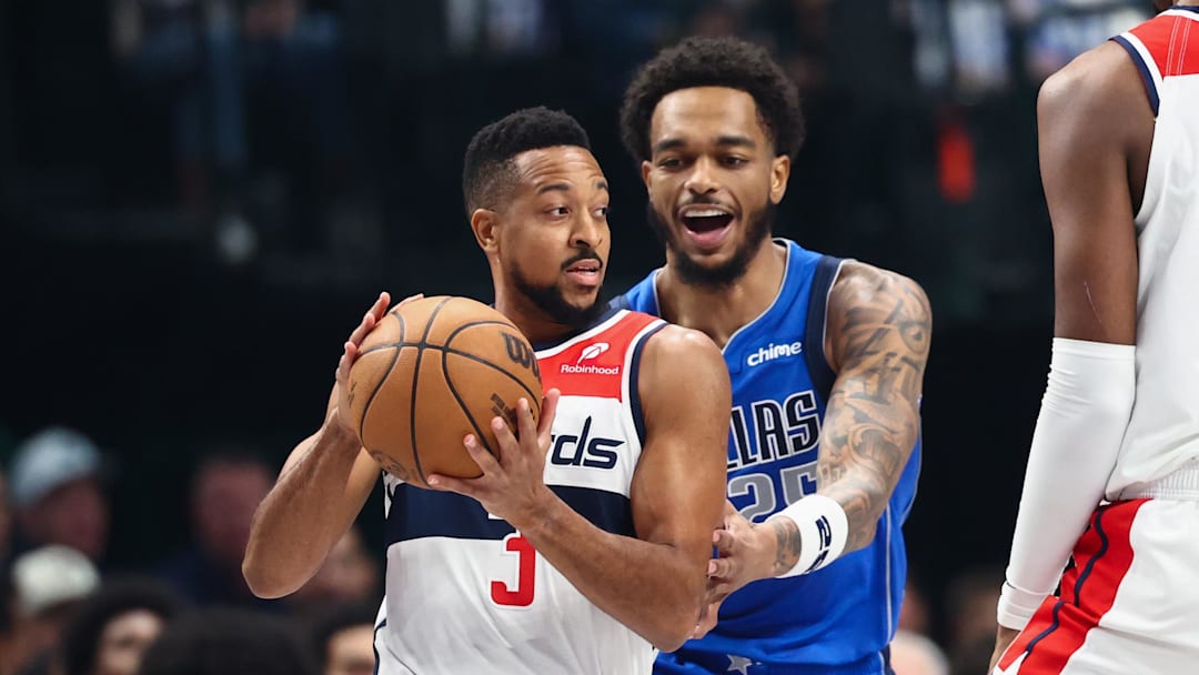 Oct 24, 2025; Dallas, Texas, USA;  Washington Wizards guard CJ McCollum (3) looks to score as Dallas Mavericks forward P.J. Washington (25) defends during the first quarter at American Airlines Center. Mandatory Credit: Kevin Jairaj-Imagn Images