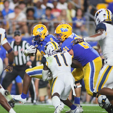 Rodney Hammond Jr. (6) of the Pittsburgh Panthers fights his way into the end zone during the second half of the Backyard Brawl against the West Virginia Mountaineers at Acrisure Stadium in Pittsburgh, PA on September 1, 2022.

Pitt Vs West Virginia Backyard Brawl