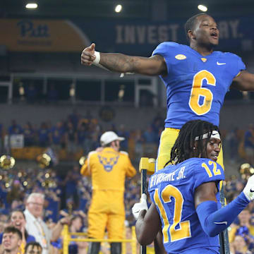 Rodney Hammond Jr. (6) and M.J. Devonshire (12) of the Pittsburgh Panthers react as the West Virginia Mountaineers walk off the field after falling to the Panthers 38-31 at Acrisure Stadium in Pittsburgh, PA on September 1, 2022.

Pitt Vs West Virginia Backyard Brawl