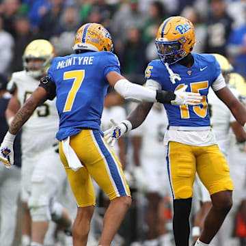 Pittsburgh Panthers defensive back Rashad Battle (15) celebrates breaking up a pass with Pittsburgh Panthers defensive back Javon McIntyre (7) during the first half against the Notre Dame Fighting Irish at Acrisure Stadium in Pittsburgh, PA on November 15, 2025.
