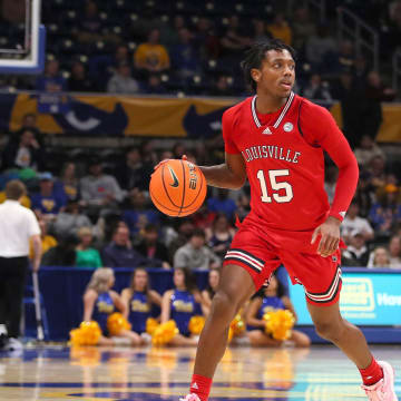 Louisville Cardinals Hercy Miller carries the ball downcourt during the second half against the Pittsburgh Panthers on February 7, 2023 at the Petersen Events Center in Pittsburgh, PA.