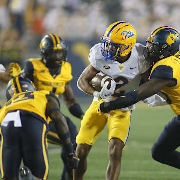 Pittsburgh Panthers Kenny Johnson (2) gets tackled by West Virginia Mountaineers Trey Lathan (19) during the second half at Milan Puskar Stadium in Morgantown, WV on September 16, 2023.