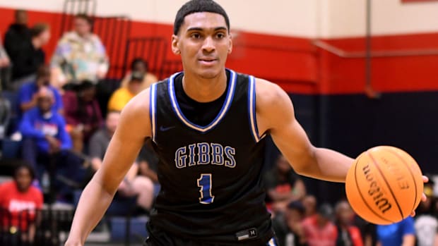 DePaul commit Isaiah Medina brings the ball upcourt against St. Thomas Aquinas in the Kingdom of the Sun championship game at