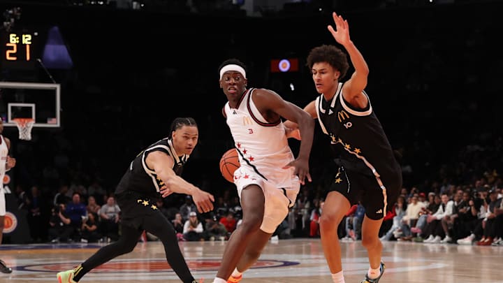 Apr 1, 2025; Brooklyn, NY, USA; McDonald's All American West forward AJ Dybantsa (3) drives to the basket against McDonald's All American East guard Zai Harwell (0) and McDonald's All American East forward Nate Ament (10) during the first half of the game at Barclays Center. Mandatory Credit: Pamela Smith-Imagn Images
