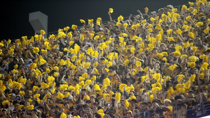 West Virginia Mountaineers fans cheer on their team during the second half against the Pittsburgh Panthers at Milan Puskar Stadium.