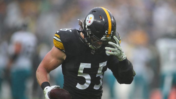 Pittsburgh Steelers Cole Holcomb pulls dirt out of his helmet after recovering a fumble during the first half against the Jacksonville Jaguars at Acrisure Stadium in Pittsburgh, PA on October 29, 2023.