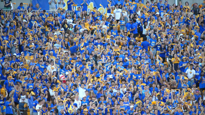 Pittsburgh Panthers student section erupts after they display the Panthers 2021 ACC Championship banner during the first half of the Backyard Brawl against West Virginia at Acrisure Stadium in Pittsburgh, PA on September 1, 2022.

Pitt Vs West Virginia Backyard Brawl