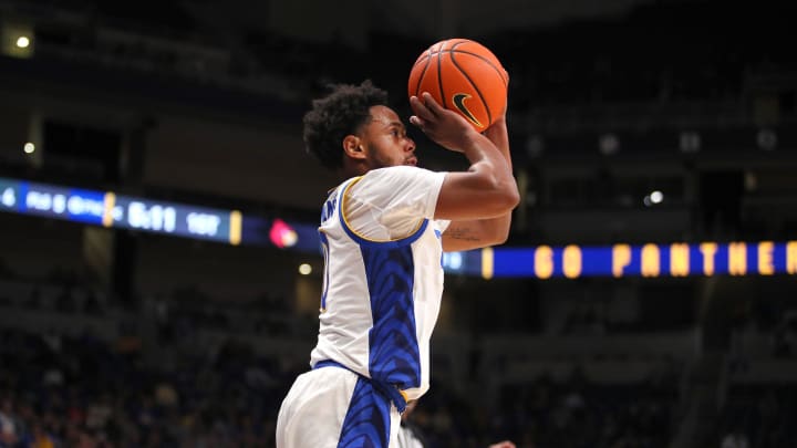 Pittsburgh Panthers Nelly Cummings shoots a three point shot during the first half against the Louisville Cardinals on February 7, 2023 at the Petersen Events Center in Pittsburgh, PA.

Pittsburgh Panthers Vs Louisville Mens Basketball