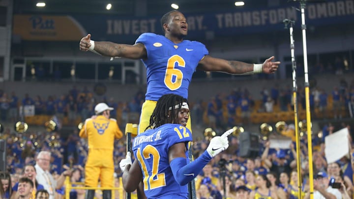 Rodney Hammond Jr. (6) and M.J. Devonshire (12) of the Pittsburgh Panthers react as the West Virginia Mountaineers walk off the field after falling to the Panthers 38-31 at Acrisure Stadium in Pittsburgh, PA on September 1, 2022.

Pitt Vs West Virginia Backyard Brawl