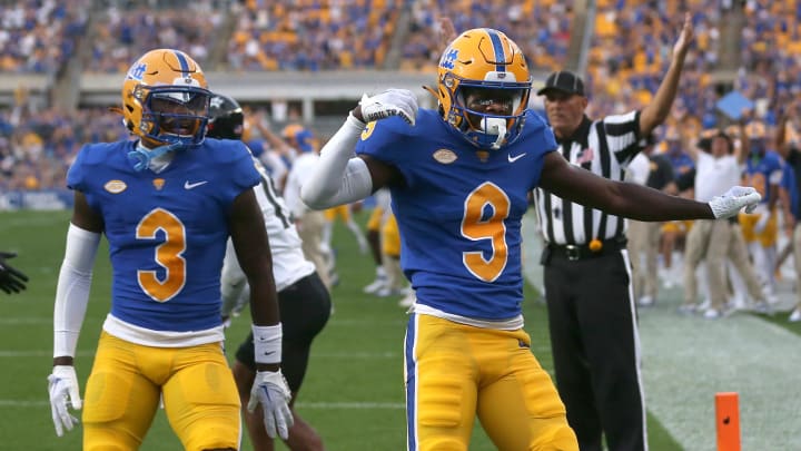 Pittsburgh Panthers Konata Mumpfield (9) reacts after scoring a touchdown during the first half against the Cincinnati Bearcats at Acrisure Stadium in Pittsburgh, PA on September 9, 2023