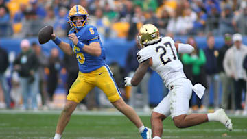 Pittsburgh Panthers quarterback Mason Heintschel (6) prepares to fire the ball downfield while being pressured by Notre Dame Fighting Irish linebacker Kyngstonn Viliamu-Asa (27) during the first half at Acrisure Stadium in Pittsburgh, PA on November 15, 2025.
