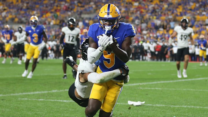 Pittsburgh Panthers Konata Mumpfield (9) hauls in a pass for a touchdown during the second half against the Cincinnati Bearcats at Acrisure Stadium in Pittsburgh, PA on September 9, 2023