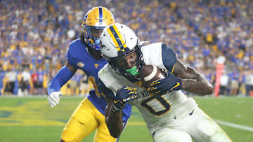 Bryce Ford-Wheaton (0) of the West Virginia Mountaineers hauls in a pass for a touchdown during the second half of the Backyard Brawl against the Pittsburgh Panthers at Acrisure Stadium in Pittsburgh, PA on September 1, 2022.

Pitt Vs West Virginia Backyard Brawl