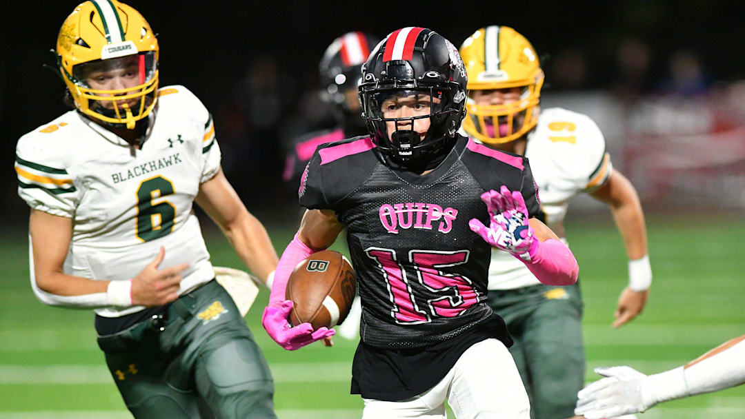 Aliquippa's Arison Walker takes a punt return all the way to the end zone for the second time during a game against Blackhawk at Aliquippa High School.