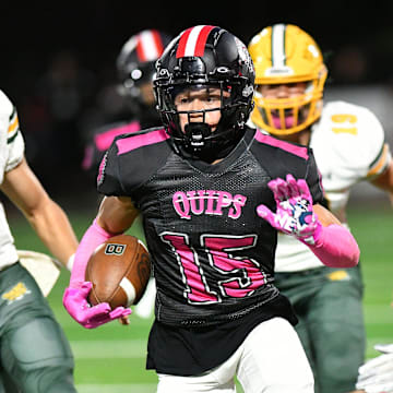 Aliquippa's Arison Walker takes a punt return all the way to the end zone for the second time during a game against Blackhawk at Aliquippa High School.