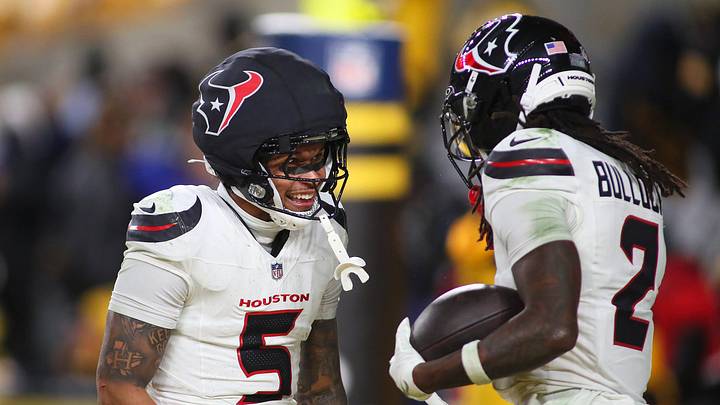 Houston Texans safety Calen Bullock (2) celebrates scoring a touchdown with safety Jalen Pitre (5) during the second half of the NFL Wild Card game against the Pittsburgh Steelers at Acrisure Stadium in Pittsburgh, PA on January 12, 2026.