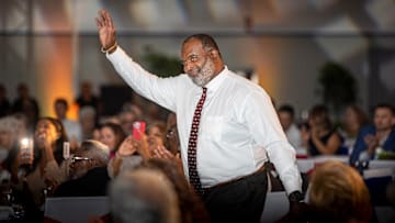 Odell Haggins raises his arm as he is introduced as a Hall Of Fame recipient during the 2022 Polk County All Sports Awards at the RP Funding Center in Lakeland  Fl. Tuesday June 14,  2022.  ERNST PETERS/ THE LEDGER

061422 Ep Sports 1 News
