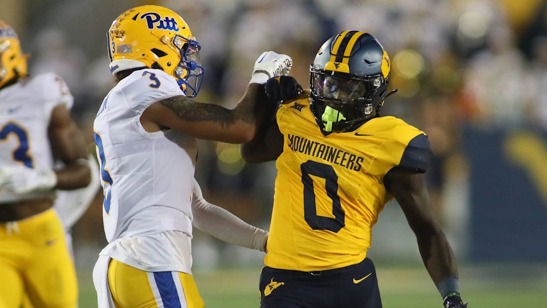 West Virginia Mountaineers Jaylen Anderson (0) exchange's words with Pittsburgh Panthers Donovan McMillon (3) during the first half at Milan Puskar Stadium in Morgantown, WV on September 16, 2023.