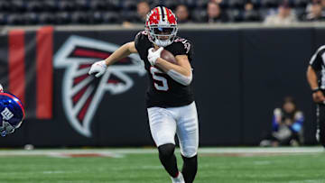 Dec 22, 2024; Atlanta, Georgia, USA; Atlanta Falcons wide receiver Drake London (5) runs after a catch against the New York Giants in the third quarter at Mercedes-Benz Stadium. Mandatory Credit: Brett Davis-Imagn Images
