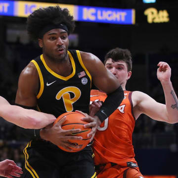Pittsburgh Panthers Blake Hinson (2) gets fouled by Virginia Tech Hokies Sean Pedulla (3) while going for a layup during the first half on February 24, 2024 at the Petersen Events Center in Pittsburgh, PA.
