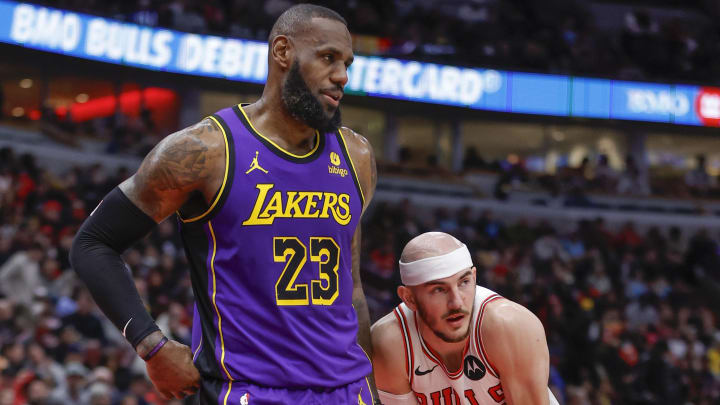 Dec 20, 2023; Chicago, Illinois, USA; Chicago Bulls guard Alex Caruso (6) guards Los Angeles Lakers forward LeBron James (23) during the first half at United Center. Mandatory Credit: Kamil Krzaczynski-USA TODAY Sports