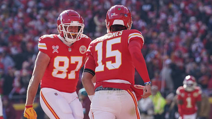 Dec 21, 2024; Kansas City, Missouri, USA; Kansas City Chiefs tight end Travis Kelce (87) celebrates with quarterback Patrick Mahomes (15) after Mahomes’ touchdown against the Houston Texans during the first half at GEHA Field at Arrowhead Stadium. Mandatory Credit: Denny Medley-Imagn Images