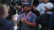 J.J. Spaun carries around his trophy while celebrating his US Open Championship win at Oakmont Country Club in Oakmont, PA on June 15, 2025.