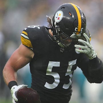 Pittsburgh Steelers Cole Holcomb pulls dirt out of his helmet after recovering a fumble during the first half against the Jacksonville Jaguars at Acrisure Stadium in Pittsburgh, PA on October 29, 2023.