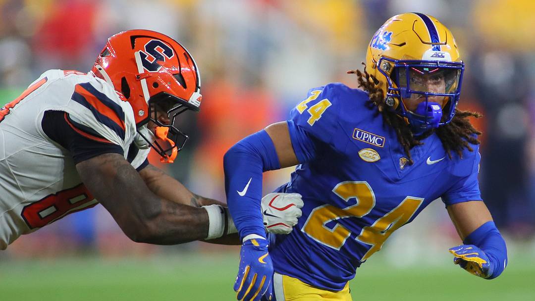 Pittsburgh Panthers linebacker Cameron Lindsey (24) pursues the ball carrier while being guarded by Syracuse Orange tight end Elijah Washington-Baker (84) during the second half at Acrisure Stadium in Pittsburgh, PA on September 17, 2026.