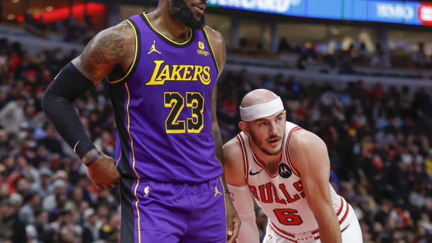 Dec 20, 2023; Chicago, Illinois, USA; Chicago Bulls guard Alex Caruso (6) guards Los Angeles Lakers forward LeBron James (23) during the first half at United Center. Mandatory Credit: Kamil Krzaczynski-USA TODAY Sports