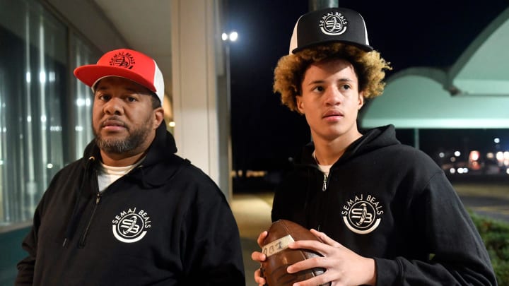 Semaj Beals, right, and his father James pose for a photo wearing Semaj's sports logo outside Lakeside Middle School in Millville on Friday, Jan. 21, 2022.

Semaj And James Beals Sports Branding Millville 15