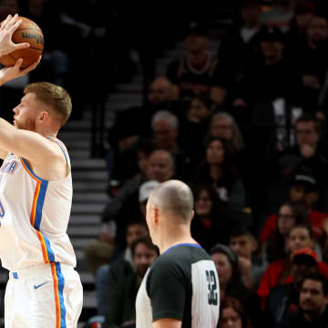 Nov 19, 2023; Portland, Oregon, USA; Oklahoma City Thunder forward Davis Bertans (9) shoots over Portland Trail Blazers guard Skylar Mays (5) in the first half at Moda Center. Mandatory Credit: Jaime Valdez-USA TODAY Sports