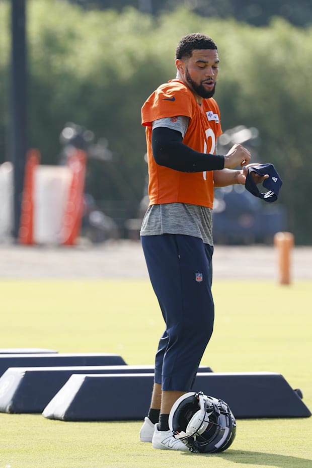 Chicago Bears quarterback Caleb Williams (18) dances on the field during training camp at Halas Hall.