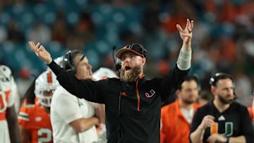 Nov 15, 2025; Miami Gardens, Florida, USA; against the Miami Hurricanes defensive coordinator Corey Hetherman reacts on the sideline against NC State Wolfpack during the fourth quarter at Hard Rock Stadium. Mandatory Credit: Sam Navarro-Imagn Images