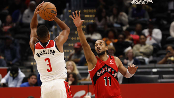 Oct 12, 2025; Washington, District of Columbia, USA; Washington Wizards guard CJ McCollum (3) shoots the ball as Toronto Raptors center Olivier Sarr (11) defends in the first half at Capital One Arena. Mandatory Credit: Geoff Burke-Imagn Images
