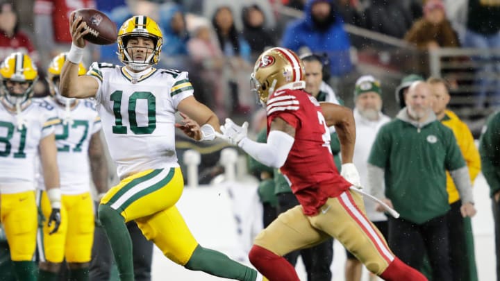 Green Bay Packers quarterback Jordan Love (10) looks to pass against San Francisco 49ers cornerback Deommodore Lenoir (2) during their NFC divisional playoff football game.