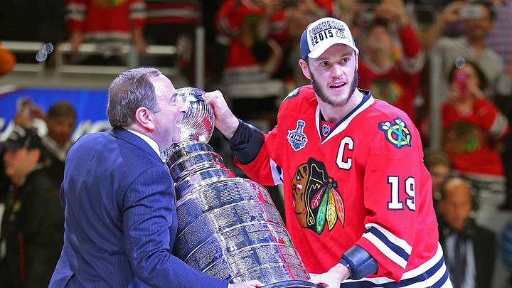 Jun 15, 2015; Chicago, IL, USA; NHL commissioner Gary Bettman presents Chicago Blackhawks center Jonathan Toews (19) with the Stanley Cup after defeating the Tampa Bay Lightning in game six of the 2015 Stanley Cup Final at United Center. Mandatory Credit: Dennis Wierzbicki-USA TODAY Sports